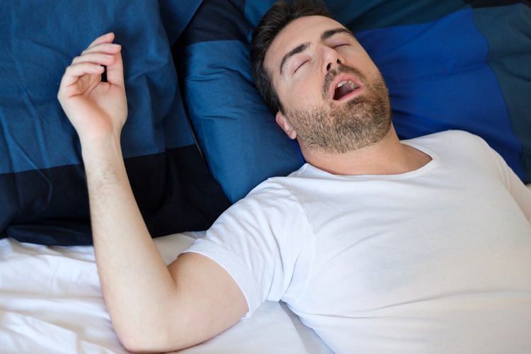 Man sleeping with sleep apnea without snoring.