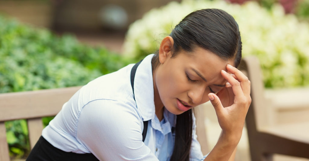 woman suffering from unexplained headache
