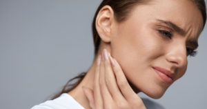 woman with tmj pain in jaw